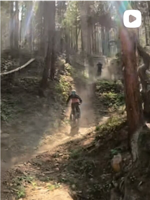 Dust trains through the timber. Group ride laps, back to back to back.